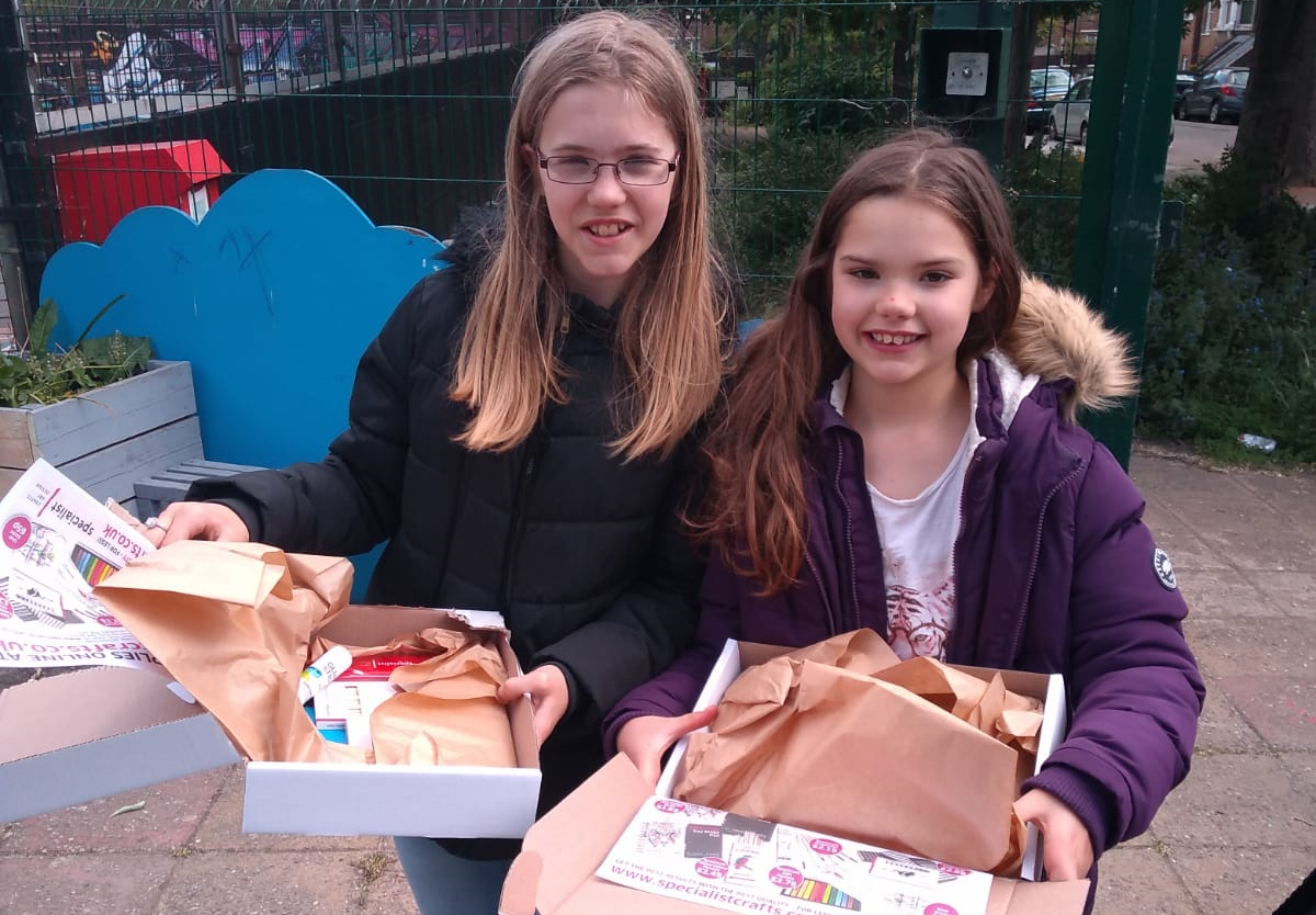 Girls with boxes – credit Islington Play Association
